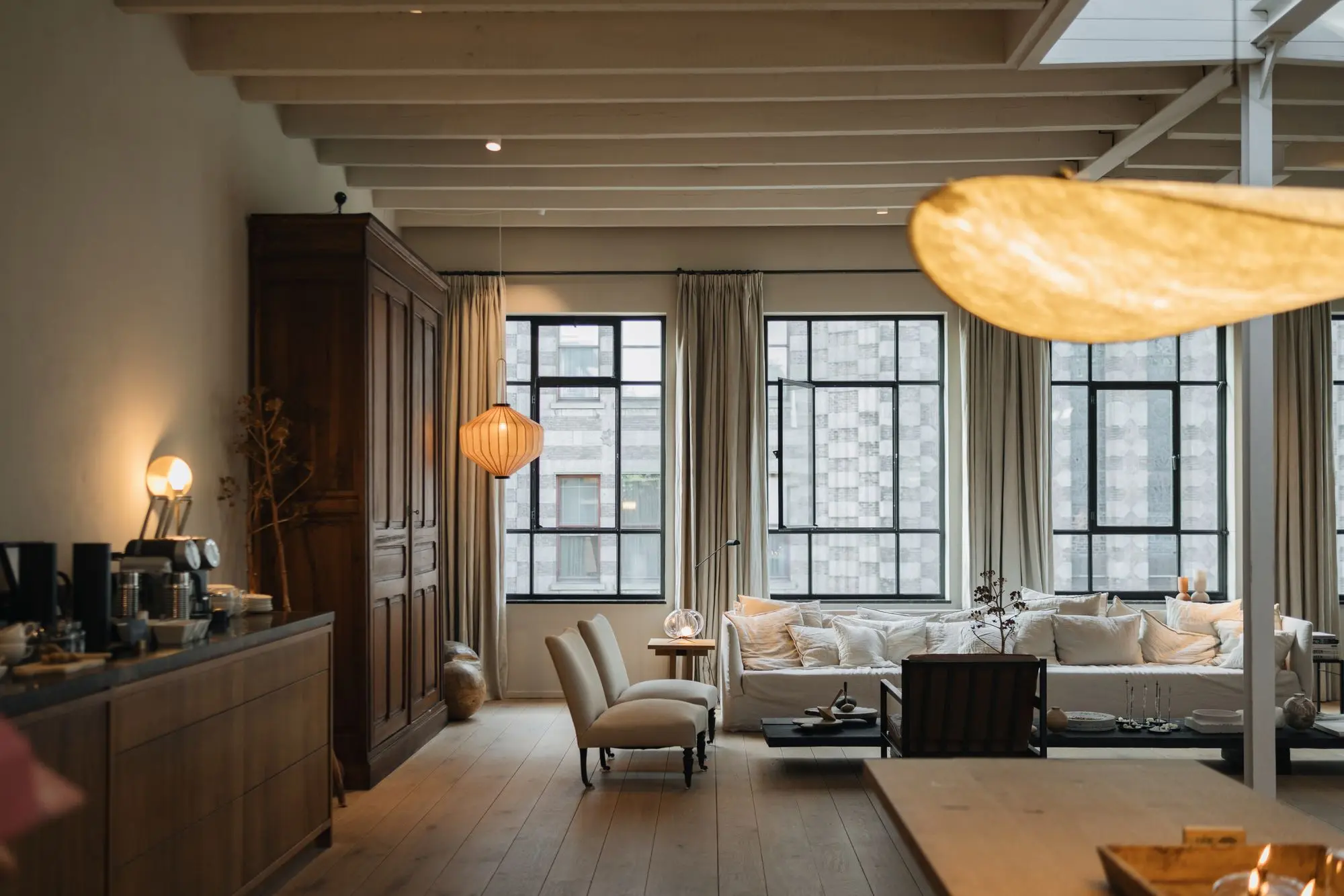 Living room with floor-to-ceiling black frame windows